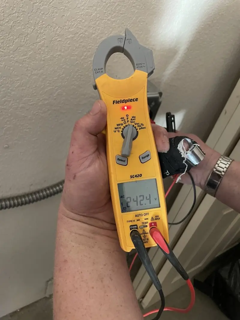 Voltage testing with clamp meter during Recessed Lighting Installation in Clarkdale
